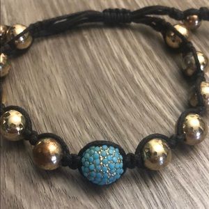 Adjustable gold and blue stone stackable bracelet
